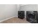 This laundry room includes a side-by-side washer and dryer and shelving for convenient storage at 5098 Burnwald Ct, Fort Mill, SC 29715