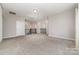 Open loft area with plush carpeting, iron railings, and multiple doorways at 5098 Burnwald Ct, Fort Mill, SC 29715