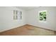 Well-lit bedroom featuring a window with a view of the lush green trees outside at 611 Annalinde Ln, Rock Hill, SC 29732