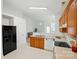 Functional kitchen with classic wood cabinets, white appliances, and an open layout, perfect for everyday cooking at 611 Annalinde Ln, Rock Hill, SC 29732