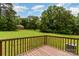 Wooden deck overlooking expansive backyard with mature trees and lawn at 828 Carver St # 17-19, Shelby, NC 28152