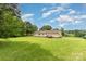 Exterior view of the home with a large grassy backyard at 828 Carver St # 17-19, Shelby, NC 28152