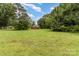 Expansive backyard with mature trees providing a sense of privacy at 828 Carver St # 17-19, Shelby, NC 28152