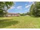 Expansive backyard with lush green lawn and distant view of the home at 828 Carver St # 17-19, Shelby, NC 28152