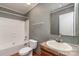 Bathroom with shower-tub, toilet, sink with mirror, and vinyl flooring at 828 Carver St # 17-19, Shelby, NC 28152