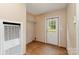 Bright entryway featuring wood-look flooring, a white door, and a built-in shelving unit for added convenience at 828 Carver St # 17-19, Shelby, NC 28152