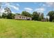 Side view of a single-Gathering home with a spacious front yard and mature trees, providing a peaceful setting at 828 Carver St # 17-19, Shelby, NC 28152