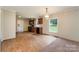 Open-concept kitchen and dining area featuring wood floors, a chandelier, and plenty of natural light at 828 Carver St # 17-19, Shelby, NC 28152