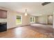 Inviting living space featuring a combination of wood flooring and carpet, bright windows, and a kitchen at 828 Carver St # 17-19, Shelby, NC 28152