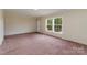 Bright living room with ample natural light from the large window at 828 Carver St # 17-19, Shelby, NC 28152