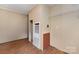 Neutral room featuring laminate flooring, a heater, and wire shelving at 828 Carver St # 17-19, Shelby, NC 28152