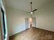 An airy bedroom featuring a fan and two closet doors for easy organization at 908 Apex Dr, Albemarle, NC 28001