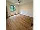 An airy bedroom features wood-look flooring and a sleek ceiling fan at 908 Apex Dr, Albemarle, NC 28001