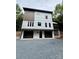 Modern two-story home showcasing white siding, dark window trim, and a two-car garage at 908 Apex Dr, Albemarle, NC 28001