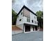Modern two-story home showcasing white siding, dark window trim, and a two-car garage at 908 Apex Dr, Albemarle, NC 28001