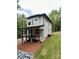 View of a modern two-story house with a covered porch and a gravel driveway at 908 Apex Dr, Albemarle, NC 28001