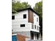 Modern two-story home featuring light siding and dark trim windows at 908 Apex Dr, Albemarle, NC 28001
