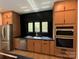 Well-lit kitchen features stainless steel appliances, ample storage and modern finishes at 908 Apex Dr, Albemarle, NC 28001