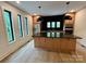 Well-appointed kitchen with an island, modern appliances, and plenty of natural light at 908 Apex Dr, Albemarle, NC 28001