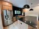 Stylish kitchen with stainless steel appliances, black countertops, and modern cabinetry at 908 Apex Dr, Albemarle, NC 28001