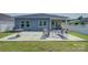 Concrete patio with striped outdoor furniture, perfect for enjoying the backyard at 9226 Dunwich Dr, Gastonia, NC 28056