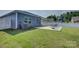 Landscaped backyard with a concrete patio and outdoor seating, perfect for entertaining or relaxing at 9226 Dunwich Dr, Gastonia, NC 28056