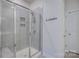 Modern bathroom featuring a glass-enclosed shower with gray tiled walls and built-in shelving at 9226 Dunwich Dr, Gastonia, NC 28056