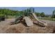 Community playground featuring a slide, climbing structure, and soft ground covering at 9226 Dunwich Dr, Gastonia, NC 28056