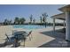 Community pool with a gradual entry point, splash pad, lounge chairs, and tables with seating at 9226 Dunwich Dr, Gastonia, NC 28056