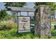 The Village at Nolen Farm community sign with stone base and landscaping at 9226 Dunwich Dr, Gastonia, NC 28056