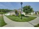 Attractive brick home exterior with a well-kept lawn, mature trees, and inviting curb appeal at 9226 Dunwich Dr, Gastonia, NC 28056