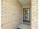 Stylish front door with wreath, welcome mat, and brick surround at 9226 Dunwich Dr, Gastonia, NC 28056