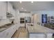 Modern kitchen with stainless steel appliances, white cabinets, granite countertops, and center island at 9226 Dunwich Dr, Gastonia, NC 28056