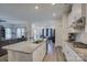 Bright kitchen featuring a large island with granite countertops and stainless steel appliances at 9226 Dunwich Dr, Gastonia, NC 28056