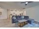 Spacious living room featuring a comfortable sofa, coffee table, and open concept to the kitchen at 9226 Dunwich Dr, Gastonia, NC 28056