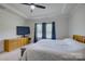 Main bedroom featuring a ceiling fan, trey ceiling, and ample natural light at 9226 Dunwich Dr, Gastonia, NC 28056