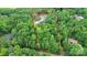A beautiful home site surrounded by mature trees is visible in this aerial of the property at 9423 Man O War Rd, Fort Mill, SC 29707