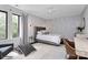 Bright bedroom with a large window, stylish furnishings, and modern decor for a serene retreat at 9423 Man O War Rd, Fort Mill, SC 29707