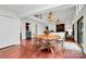 Bright dining area featuring a wood table and clear chairs under modern pendant lighting at 9423 Man O War Rd, Fort Mill, SC 29707