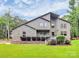 Charming two-story home featuring a stone facade, well-maintained lawn, and inviting entryway at 9423 Man O War Rd, Fort Mill, SC 29707