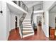 Spacious foyer with hardwood floors, modern staircase, and natural light at 9423 Man O War Rd, Fort Mill, SC 29707
