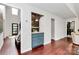 Hallway with hardwood floors, featuring a built-in bar, and a view to the entry at 9423 Man O War Rd, Fort Mill, SC 29707