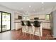 Well-lit kitchen boasts a central island with barstool seating and modern appliances at 9423 Man O War Rd, Fort Mill, SC 29707