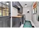 Functional laundry room with custom cabinetry, a butcher block countertop, and modern appliances at 9423 Man O War Rd, Fort Mill, SC 29707