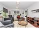 Comfortable living room with hardwood floors, modern decor, and plenty of natural light at 9423 Man O War Rd, Fort Mill, SC 29707