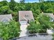Inviting one-story home featuring an attached garage, neutral paint, well-manicured lawn, and mature trees at 964 Knob Creek Ln, Fort Mill, SC 29708