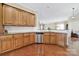 Well-equipped kitchen featuring stainless steel appliances, wooden cabinetry and hardwood floors for a modern aesthetic at 964 Knob Creek Ln, Fort Mill, SC 29708