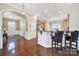 Spacious kitchen featuring wooden floors, countertops, white walls and modern appliances perfect for cooking and entertaining at 964 Knob Creek Ln, Fort Mill, SC 29708