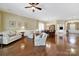 Spacious living room and dining area with hardwood floors, neutral paint, and classic furnishings at 964 Knob Creek Ln, Fort Mill, SC 29708