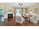 Inviting living room featuring hardwood floors, a fireplace, and ample seating, creating a warm and welcoming atmosphere at 964 Knob Creek Ln, Fort Mill, SC 29708